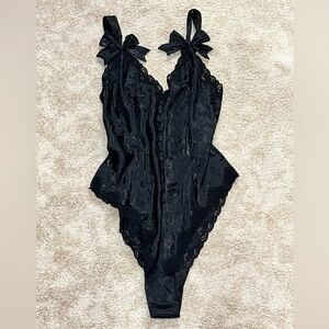 Victoria Secret black body suit with lace and bows size medium
